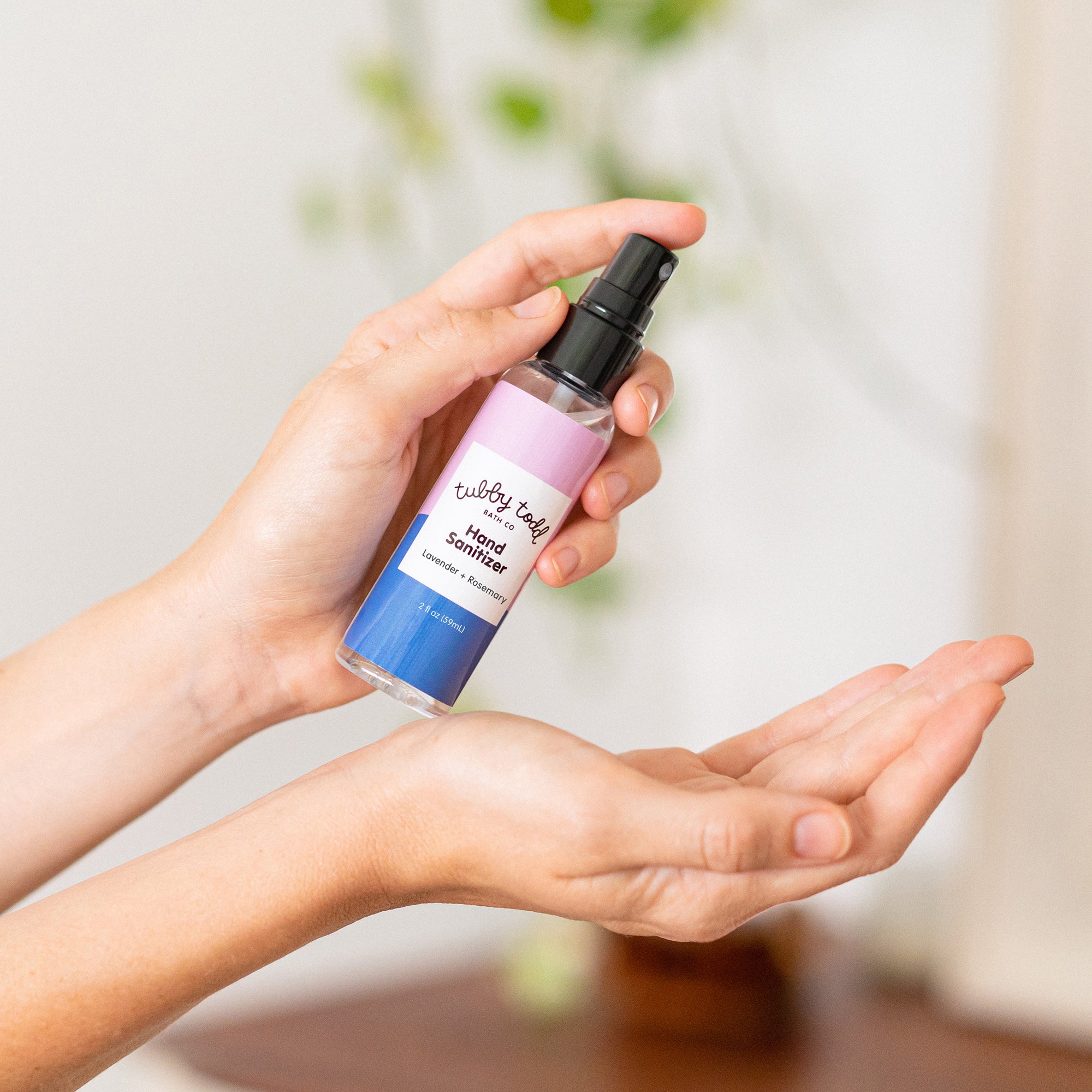 Hands applying hand sanitizer